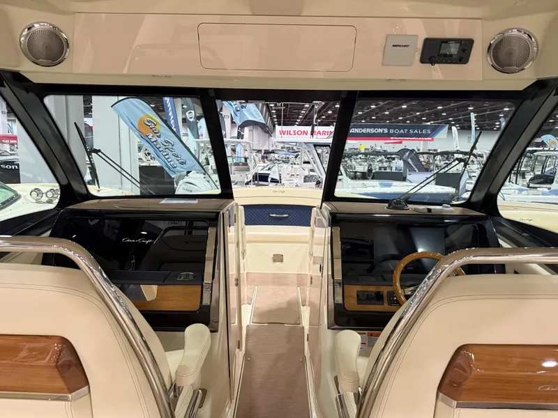 Slide: The Image of 2025 Chris-Craft Calypso 32 boat interior with modern dashboard and seating. - 3