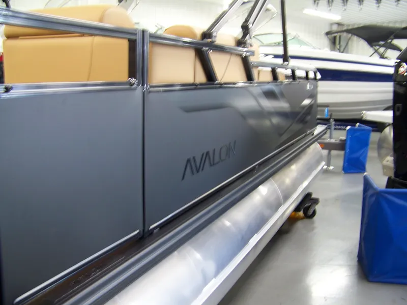 Slide: The Image of 2025 Avalon Venture 85 Versatile rear Bench pontoon boat in showroom. - 3