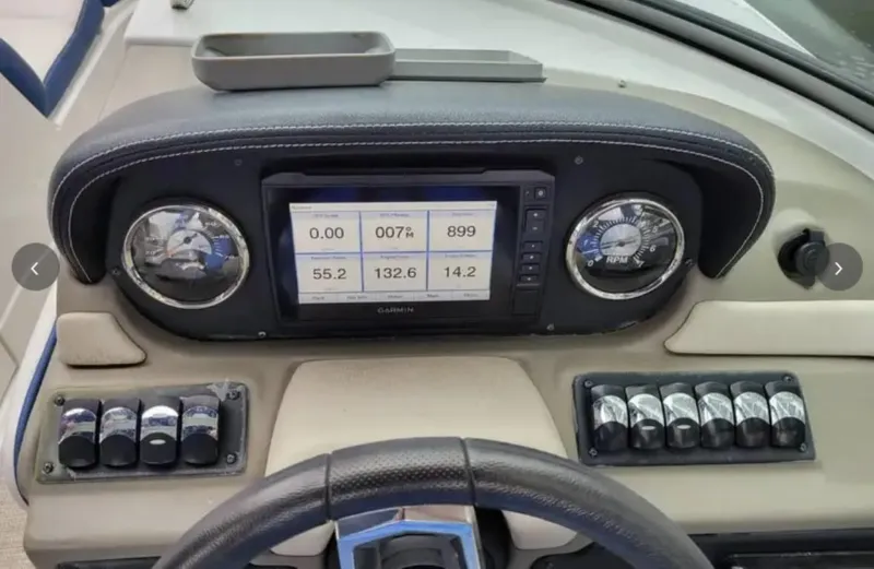 Slide: The Image of Dashboard of 2020 Crownline Eclipse E255 XS boat with gauges and digital display. - 5
