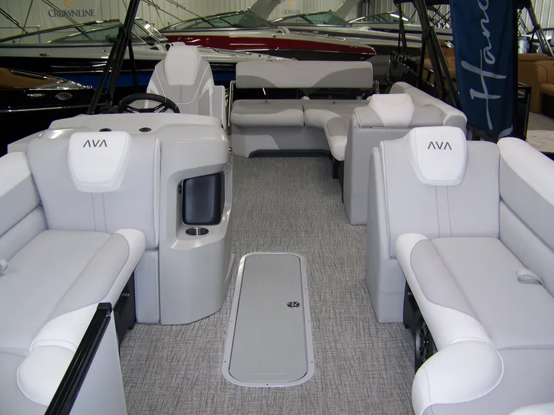 Slide: The Image of 2025 Avalon LSZ23CRB pontoon boat interior with plush seating and modern design. - 2