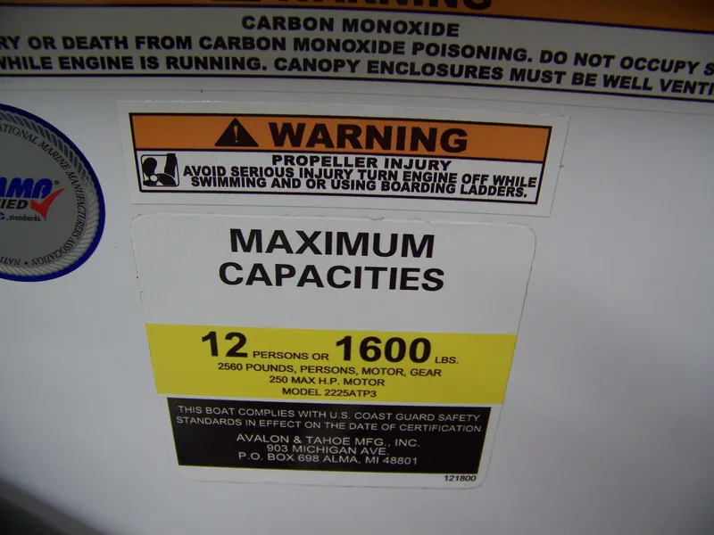 Slide: The Image of Warning label on Avalon LSZ23CRB 2025 boat showing maximum capacity and safety instructions. - 5