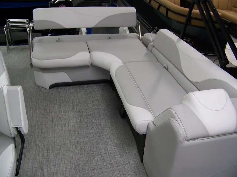 Slide: The Image of 2025 Avalon LSZ23CRB pontoon boat interior with gray seating and carpet flooring. - 7