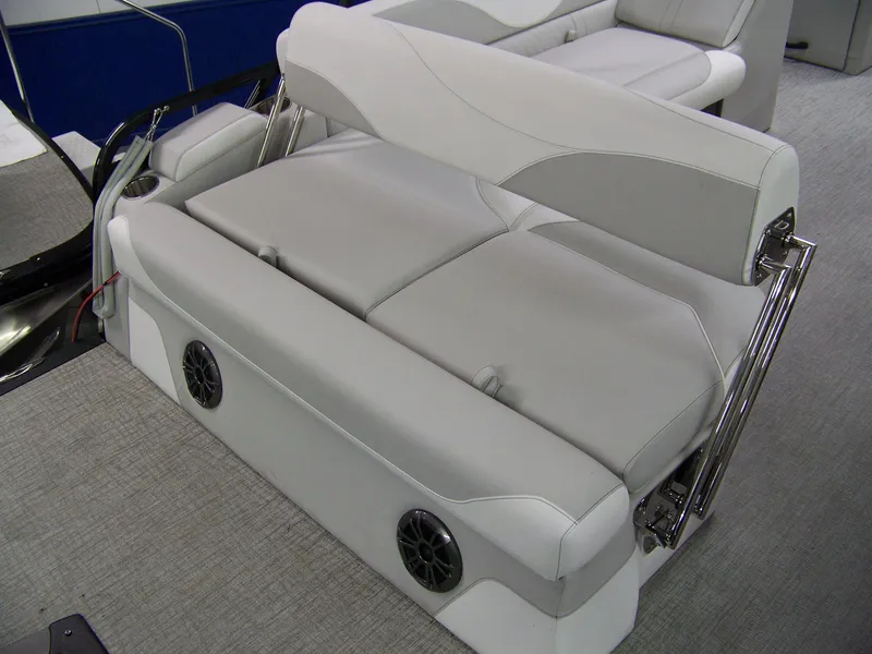 Slide: The Image of Avalon LSZ23CRB 2025 boat interior with gray seating and built-in speakers. - 8