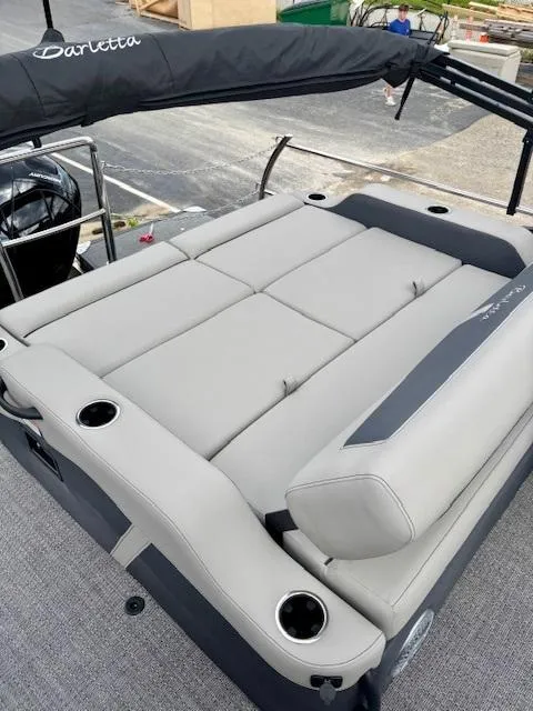 Slide: The Image of 2025 Barletta C22UC pontoon boat with spacious seating and sleek design. - 17
