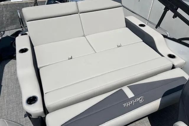 Slide: The Image of 2025 Barletta C22UC boat interior with gray cushioned seating and cup holders. - 20