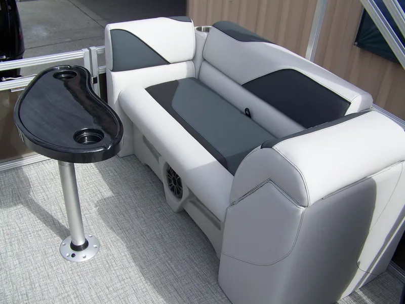 Slide: The Image of Luxurious seating in 2025 Avalon Venture 21QL boat with sleek black table. - 11