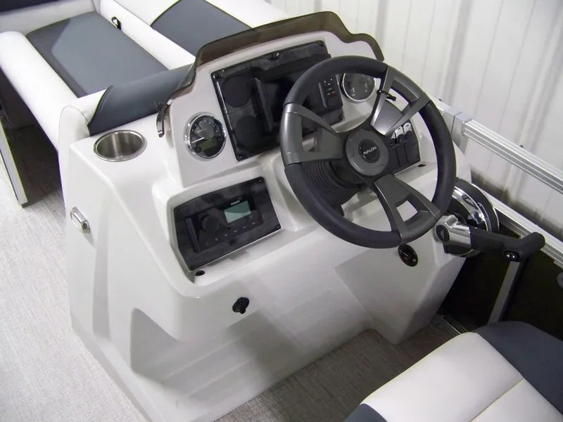 Slide: The Image of 2025 Avalon Venture 21QL boat helm with steering wheel and control panel. - 6