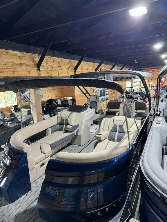 Slide: The Image of 2025 Harris Grand Mariner 230 SLDH pontoon boat with luxurious seating in showroom. - 3