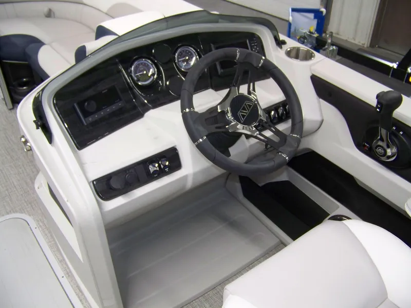 Slide: The Image of 2025 Avalon LSZ25QLS boat dashboard with steering wheel and controls. - 7