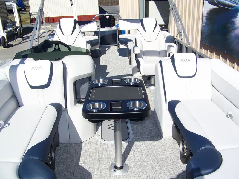 Slide: The Image of 2025 Avalon LSZ25QLS pontoon boat interior with luxurious seating and cup holders. - 9