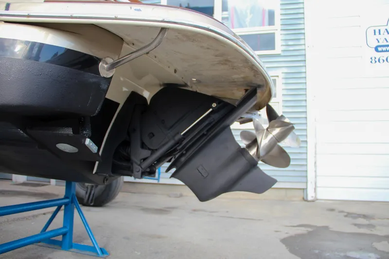 Slide: The Image of 2014 Chris-Craft Capri 21 dashboard with controls and cup holders. - 10