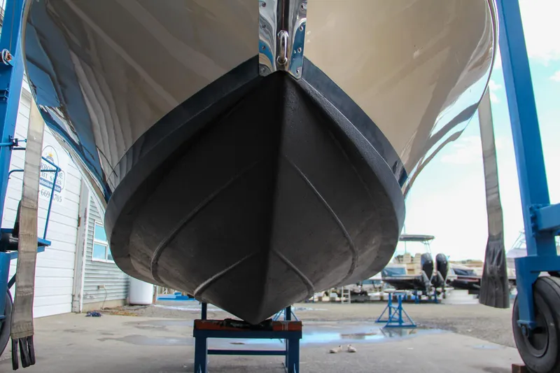 Slide: The Image of 2014 Chris-Craft Capri 21 boat with teak deck and elegant branding. - 12