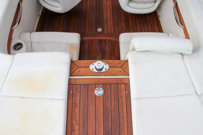 Slide: The Image of 2014 Chris-Craft Capri 21 boat hull on a lift, showcasing sleek design. - 16