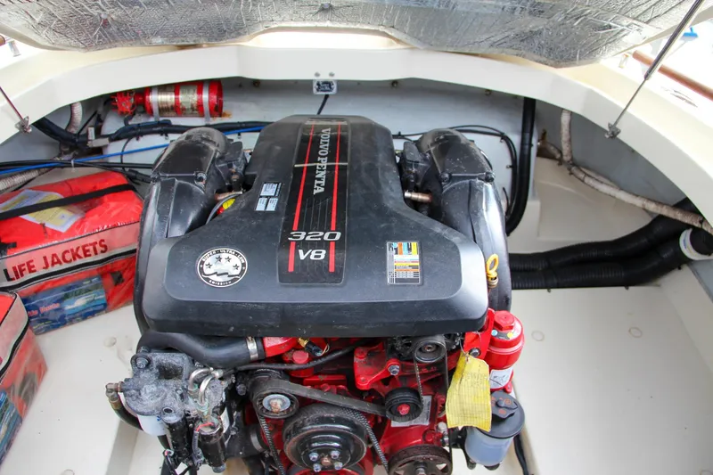 Slide: The Image of 2014 Chris-Craft Capri 21 boat underside showing propeller and trim tabs. - 18