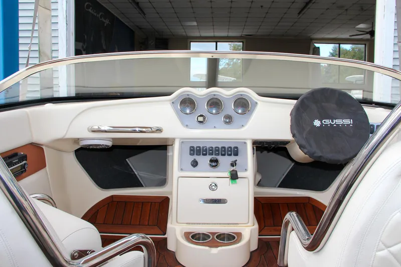 Slide: The Image of 2014 Chris-Craft Capri 21 engine compartment with V8 engine and safety equipment. - 20