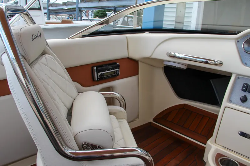 Slide: The Image of Luxurious interior of 2014 Chris-Craft Capri 21 boat with plush seating and elegant design. - 21
