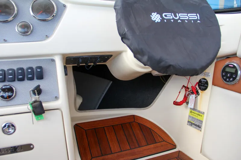 Slide: The Image of Luxurious interior of 2014 Chris-Craft Capri 21 boat with leather seating and wood accents. - 23