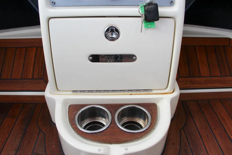 Slide: The Image of 2014 Chris-Craft Capri 21 steering wheel with wood and chrome accents. - 28