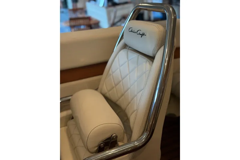 Slide: The Image of 2014 Chris-Craft Capri 21 boat with wooden deck and sleek design. - 37