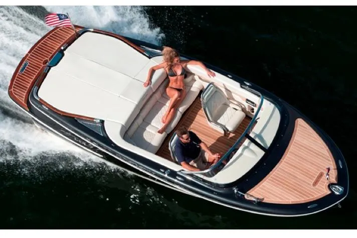 Slide: The Image of Interior of 2014 Chris-Craft Capri 21 boat with wooden steering wheel and classic dashboard. - 40