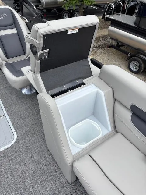 Slide: The Image of 2025 Barletta C24UC boat with open storage compartment and seating area. - 10