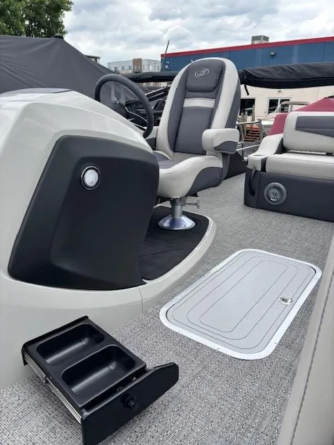 Slide: The Image of 2025 Barletta C24UC boat interior with captain's chair and modern dashboard. - 3
