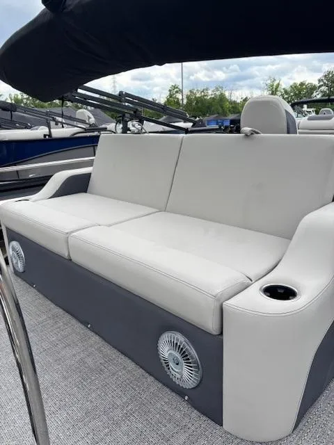 Slide: The Image of 2025 Barletta C24UC boat with comfortable seating and cup holders. - 5