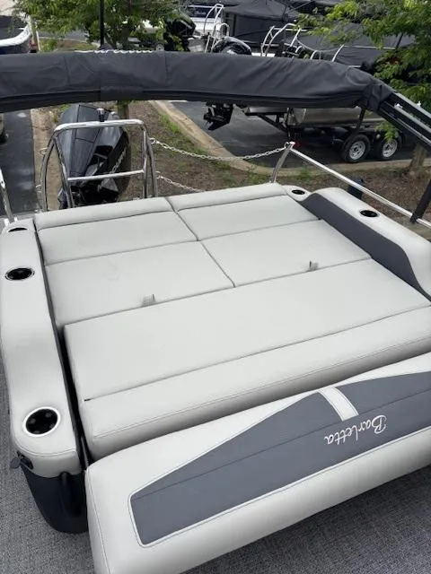 Slide: The Image of 2025 Barletta C24UC boat with spacious seating and sleek design. - 9
