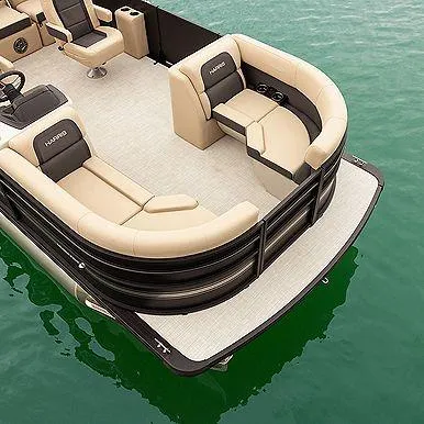 Slide: The Image of 2025 Harris Cruiser 210 FC pontoon boat with beige seating on green water. - 9