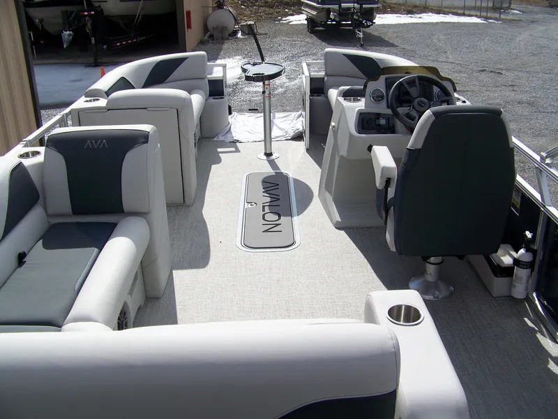 Slide: The Image of 2025 Avalon Venture 85 23VRB pontoon boat interior with plush seating and modern helm. - 14