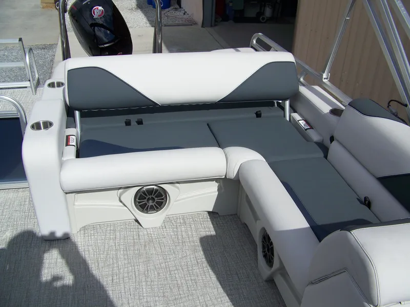 Slide: The Image of Avalon Venture 85 23VRB 2025 boat interior with cushioned seating and built-in speakers. - 8