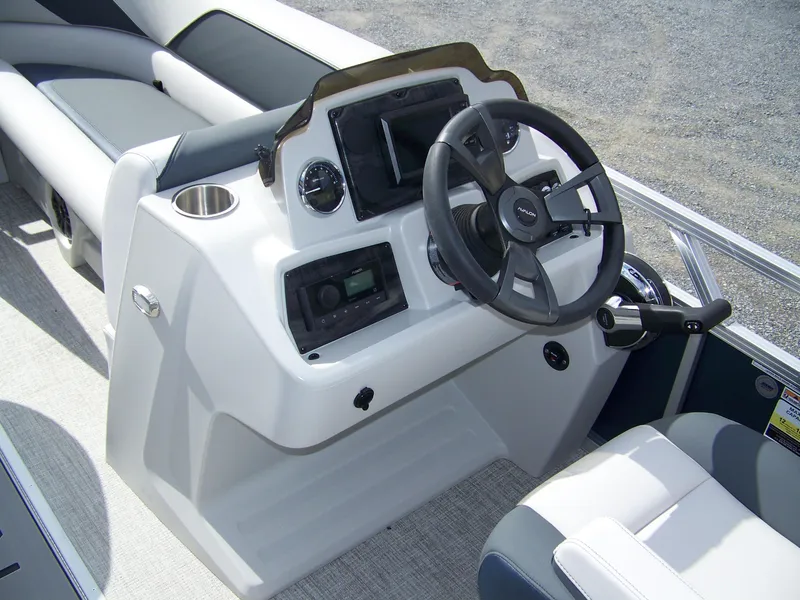 Slide: The Image of 2025 Avalon Venture 85 23VRB boat dashboard with steering wheel and controls. - 9