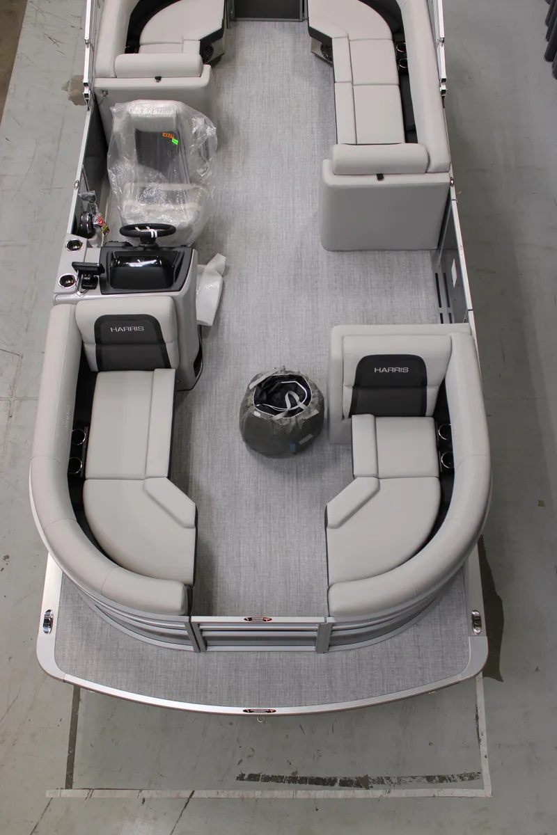 Slide: The Image of 2025 Harris Cruiser 210 CW pontoon boat with spacious seating and modern design. - 2