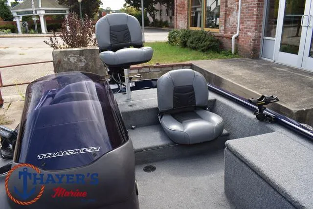 Slide: The Image of 2019 Tracker Pro 170 boat interior with seating and motor, displayed at Thayer's Marine. - 15