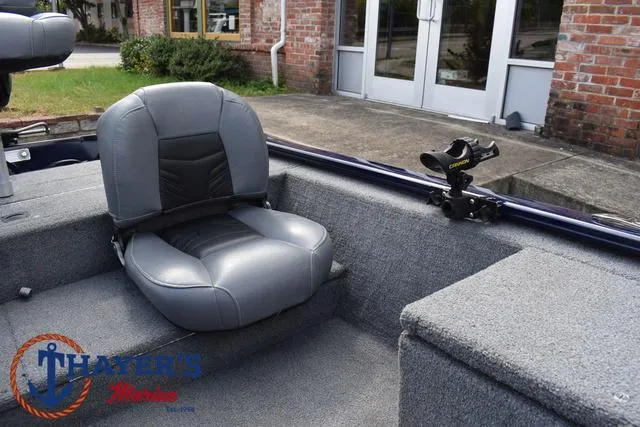 Slide: The Image of 2019 Tracker Pro 170 boat interior with gray seating and fishing rod holder. - 16
