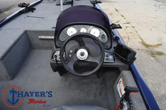 Slide: The Image of 2019 Tracker Pro 170 boat dashboard with steering wheel and gauges. - 21