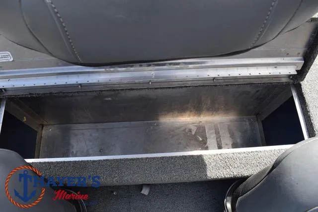 Slide: The Image of 2019 Tracker Pro 170 boat storage compartment, gray interior, Ayers Marine logo visible. - 25