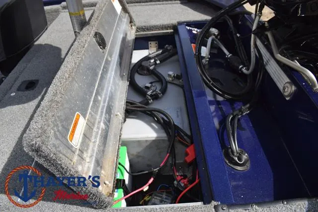 Slide: The Image of 2019 Tracker Pro 170 boat battery compartment with wiring and components. - 26