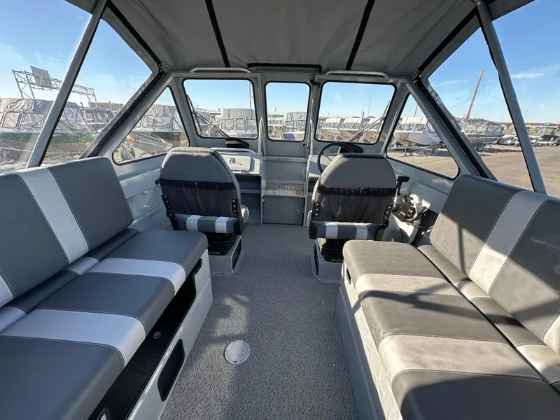 Slide: The Image of 2025 Hewescraft 200 ProV boat interior with spacious seating and modern design. - 6