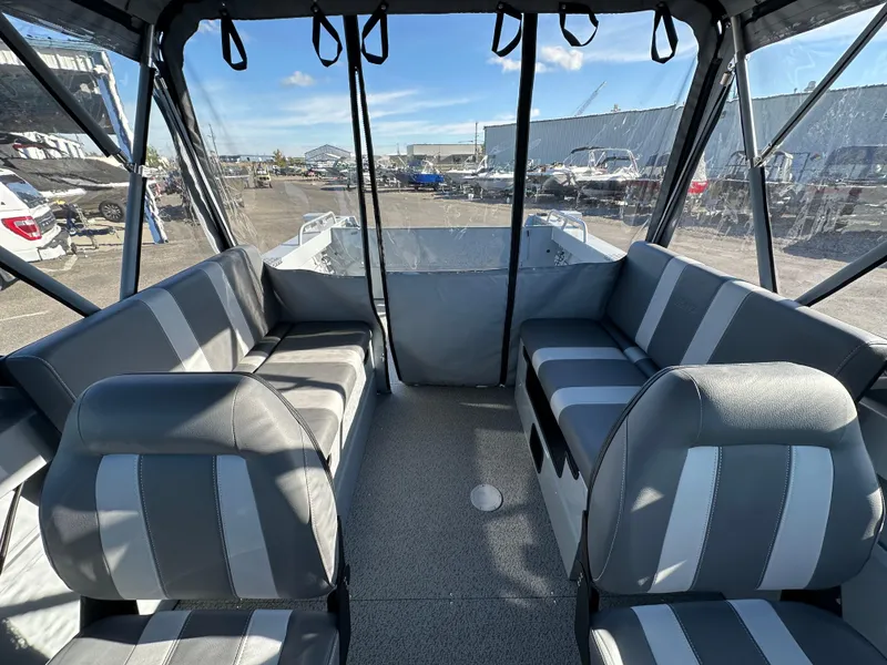 Slide: The Image of 2025 Hewescraft 200 ProV boat interior with gray striped seating. - 8
