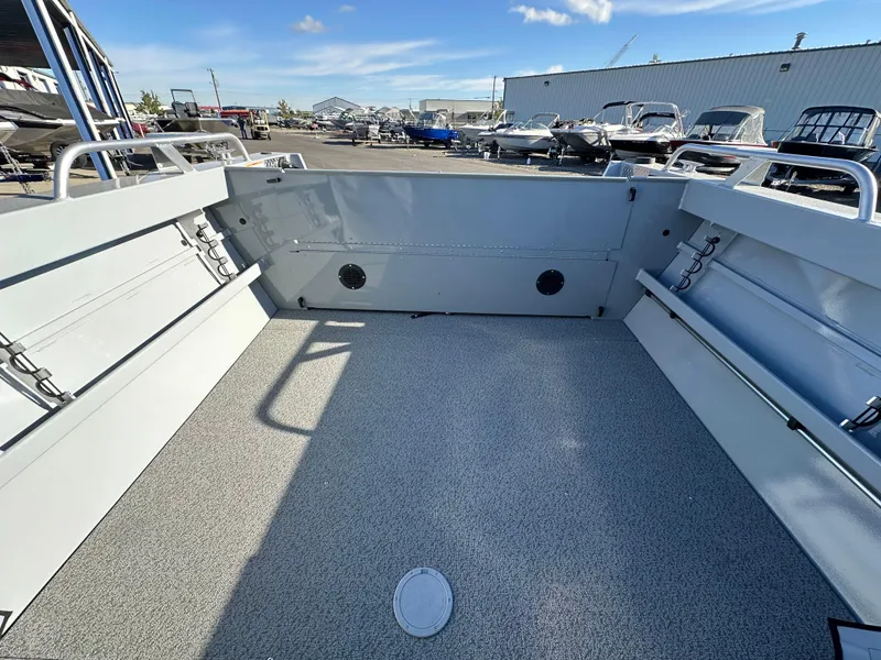 Slide: The Image of 2025 Hewescraft 200 ProV boat interior with spacious deck and storage compartments. - 9