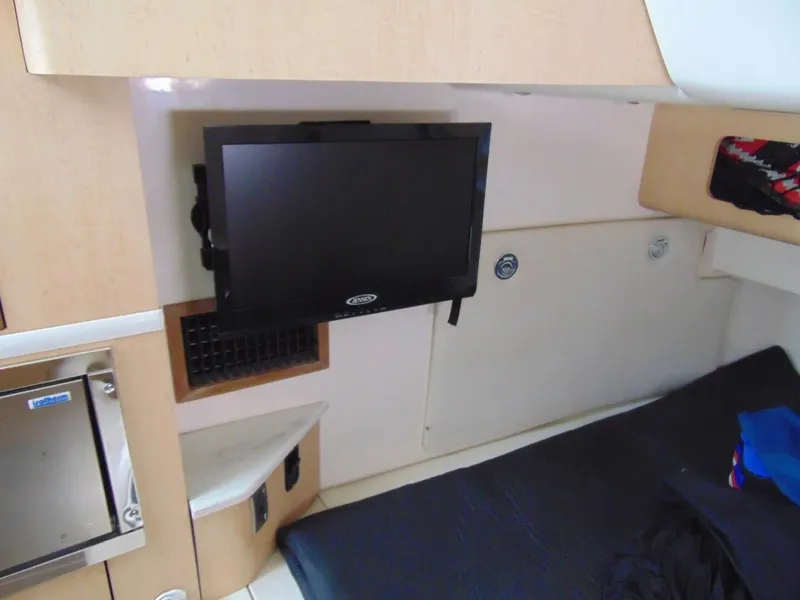 Slide: The Image of Interior cabin of 2013 Boston Whaler 370 Outrage with mounted TV and bed. - 22