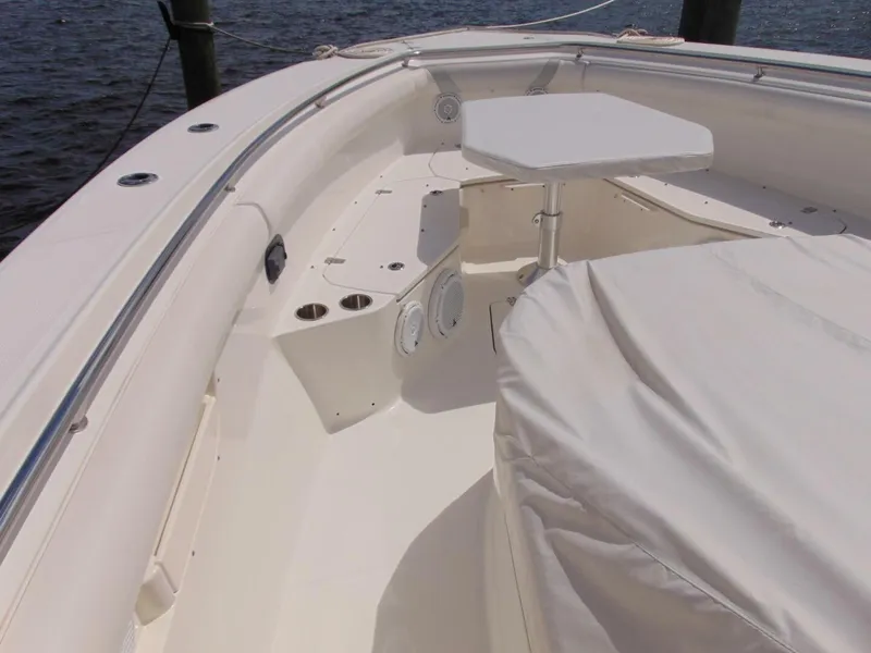 Slide: The Image of 2013 Boston Whaler 370 Outrage boat interior with seating and table. - 8