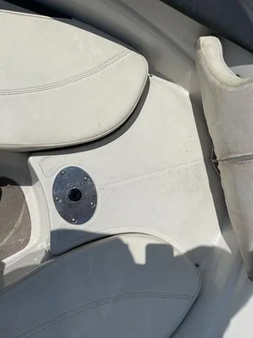 Slide: The Image of 2014 Tahoe Q5i SF boat interior with white seating and floor. - 10