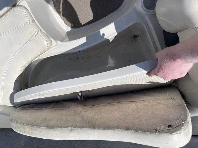 Slide: The Image of 2014 Tahoe Q5i SF boat seat storage compartment being opened. - 11