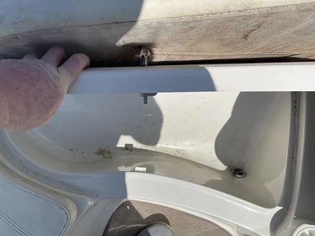 Slide: The Image of Storage compartment in a 2014 Tahoe Q5i SF boat, partially open. - 12