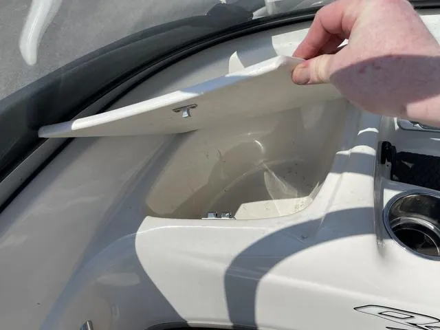 Slide: The Image of 2014 Tahoe Q5i SF boat storage compartment with open lid. - 15