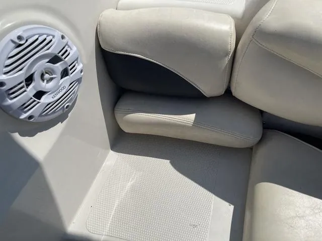 Slide: The Image of 2014 Tahoe Q5i SF boat interior with speaker and cushioned seating. - 19