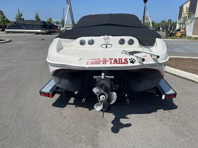 Slide: The Image of 2014 Tahoe Q5i SF boat with "Fish-N-Tails" decal, parked on a trailer. - 4