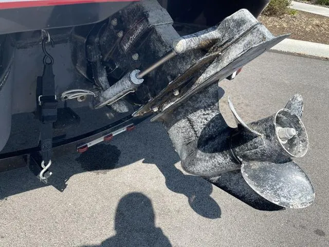 Slide: The Image of 2014 Tahoe Q5i SF boat propeller and outdrive on pavement. - 5